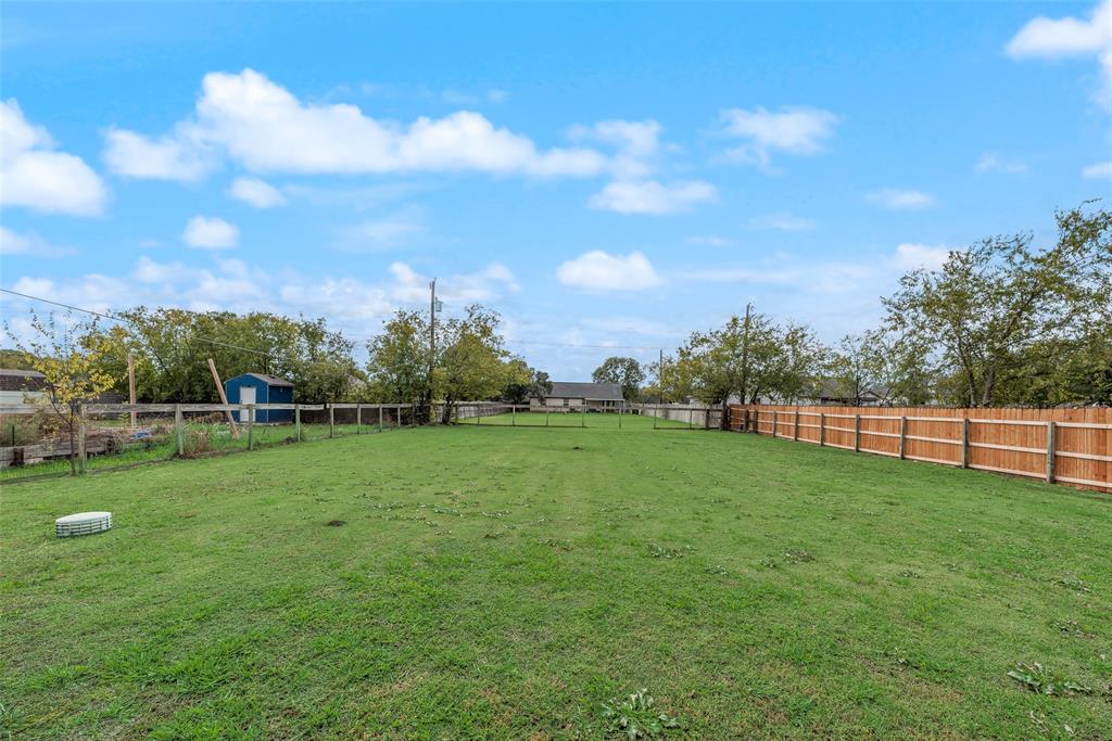 613 Torero Trail Oak Point, TX 75068 - Photo 22 of 32 a view of a green yard