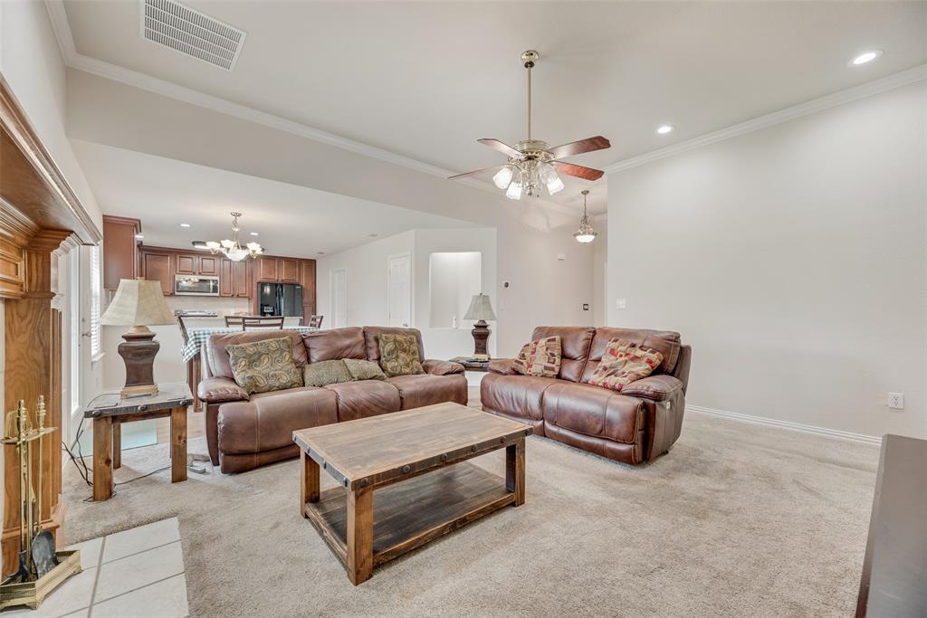 613 Torero Trail Oak Point, TX 75068 - Photo 7 of 32 a living room with furniture and a chandelier