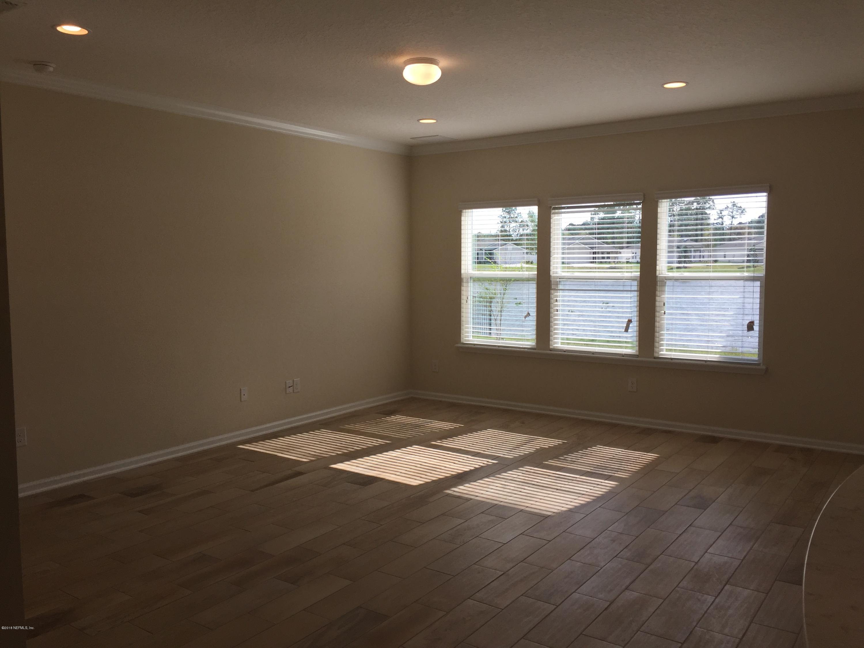 912 Deer Crossing Road St. Augustine, FL 32086 - Photo 8 of 45 an empty room with windows
