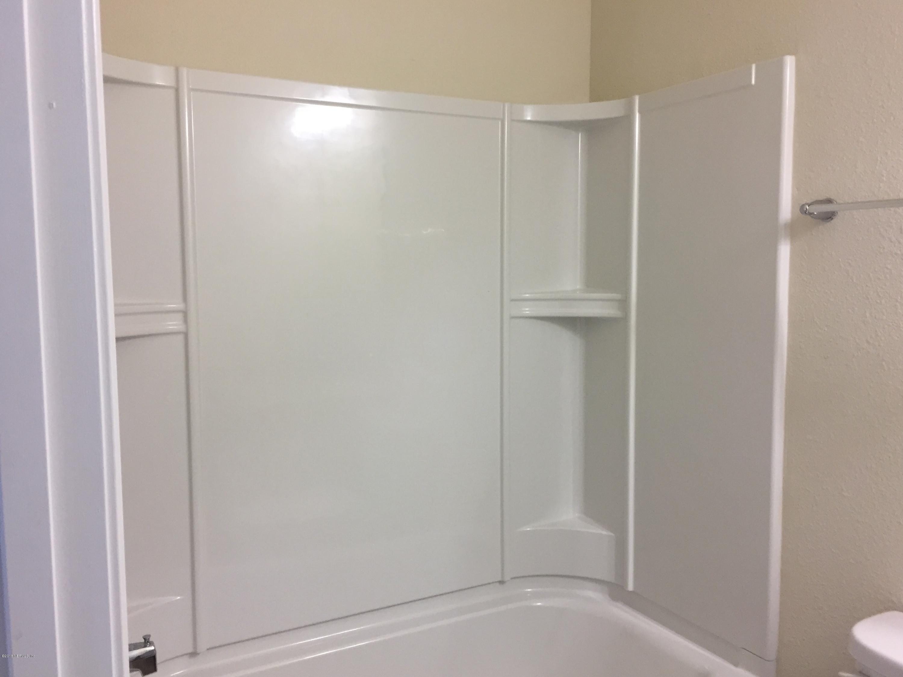 912 Deer Crossing Road St. Augustine, FL 32086 - Photo 10 of 45 a bathroom with a shower