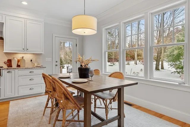 a view of room with hardwood and front door