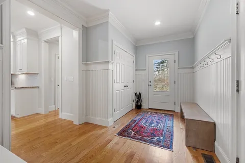 a bathroom with a sink a toilet and a window