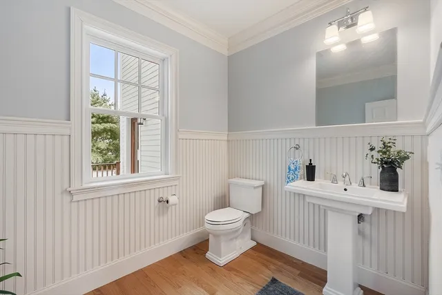 a view of entryway with wooden floor and stairs