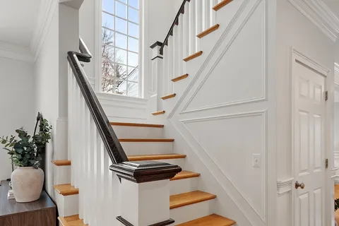 a bedroom with a bed and a chair