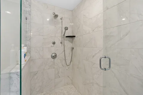 a bedroom with a bed and a lamp