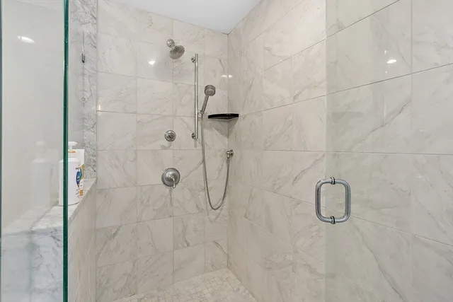 a bedroom with a bed and a lamp