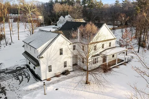 a view of a large white house with a large windows