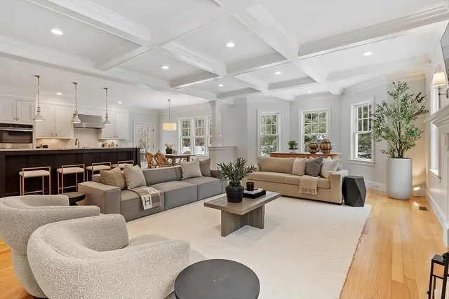 a living room with furniture fireplace and flat screen tv
