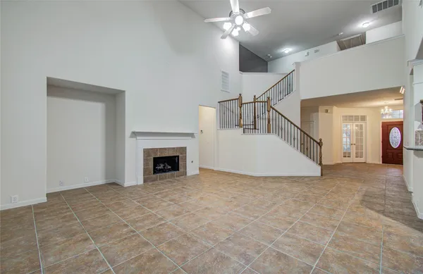 a view of a livingroom with an empty space and a fireplace
