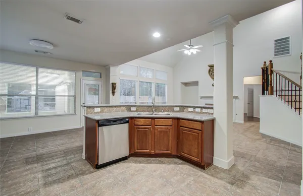 a kitchen with stainless steel appliances granite countertop a stove and a sink