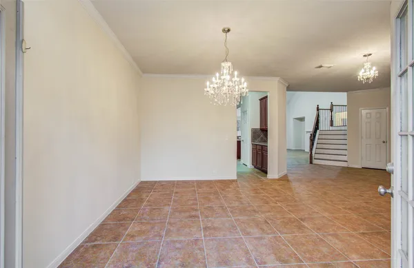 a view of a chandelier and entryway