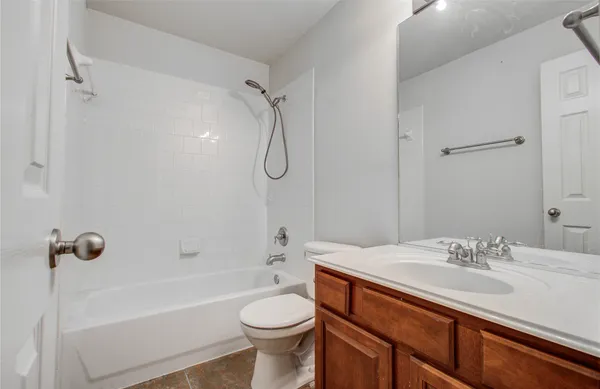 a bathroom with a sink a toilet and a bathtub