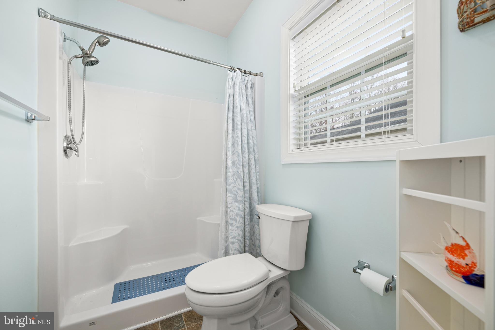 27400 Walking Run Milton, DE 19968 - Photo 11 of 35 a white toilet sitting next to a bathroom sink