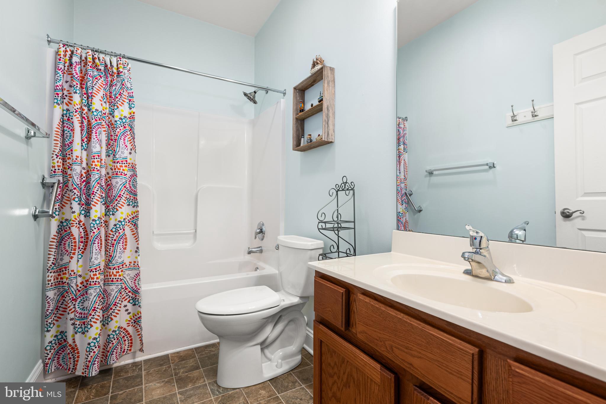 27400 Walking Run Milton, DE 19968 - Photo 13 of 35 a bathroom with a sink and a mirror