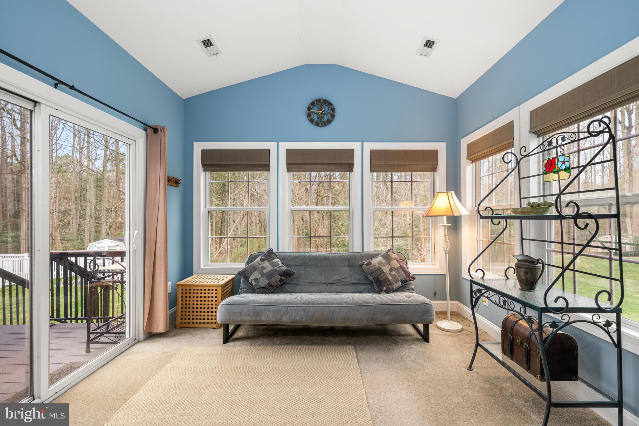 27400 Walking Run Milton, DE 19968 - Photo 16 of 35 a living room with furniture and a floor to ceiling window
