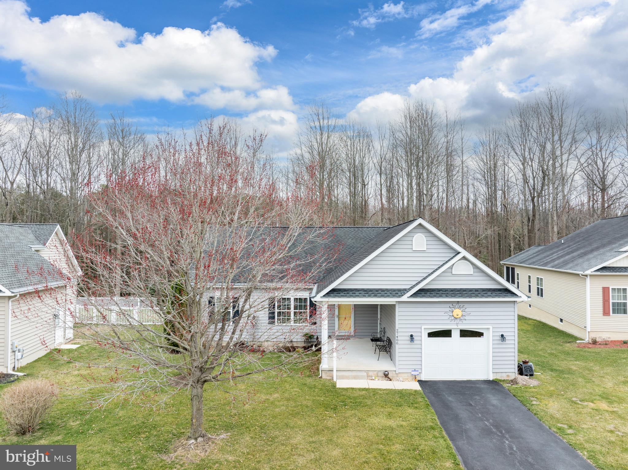 27400 Walking Run Milton, DE 19968 - Photo 2 of 35 a front view of a house with garden