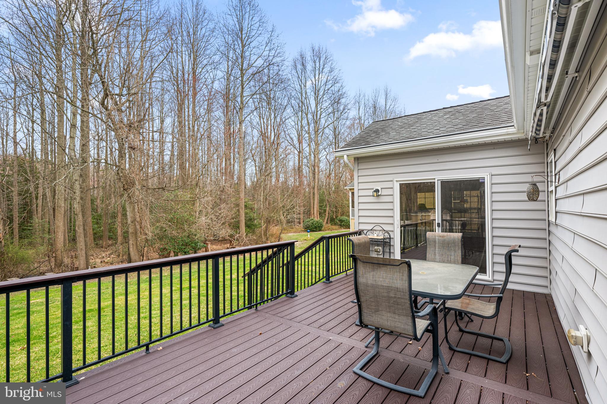 27400 Walking Run Milton, DE 19968 - Photo 21 of 35 a view of a chair and table on the wooden deck