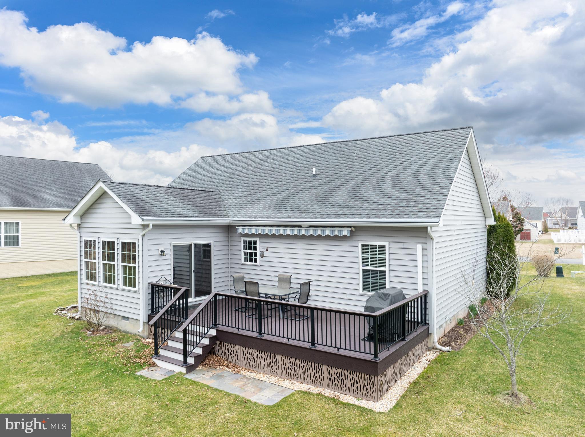 27400 Walking Run Milton, DE 19968 - Photo 25 of 35 a view of a house with backyard porch and sitting area