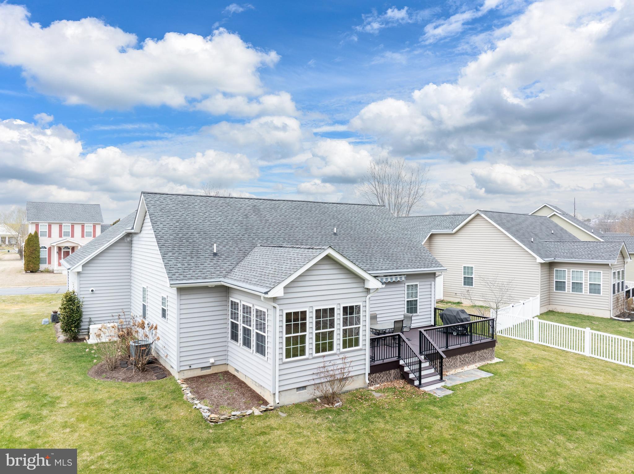 27400 Walking Run Milton, DE 19968 - Photo 26 of 35 a view of a house with a yard and sitting area