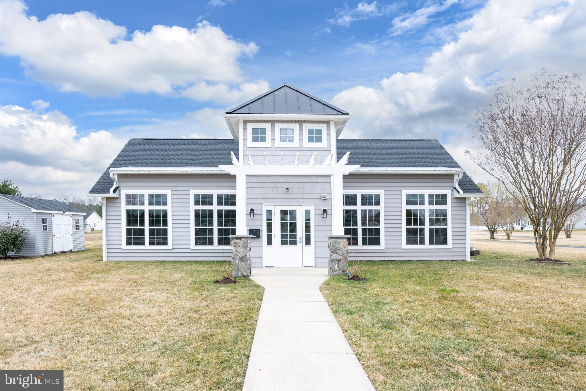 27400 Walking Run Milton, DE 19968 - Photo 34 of 35 a front view of a house with a garden