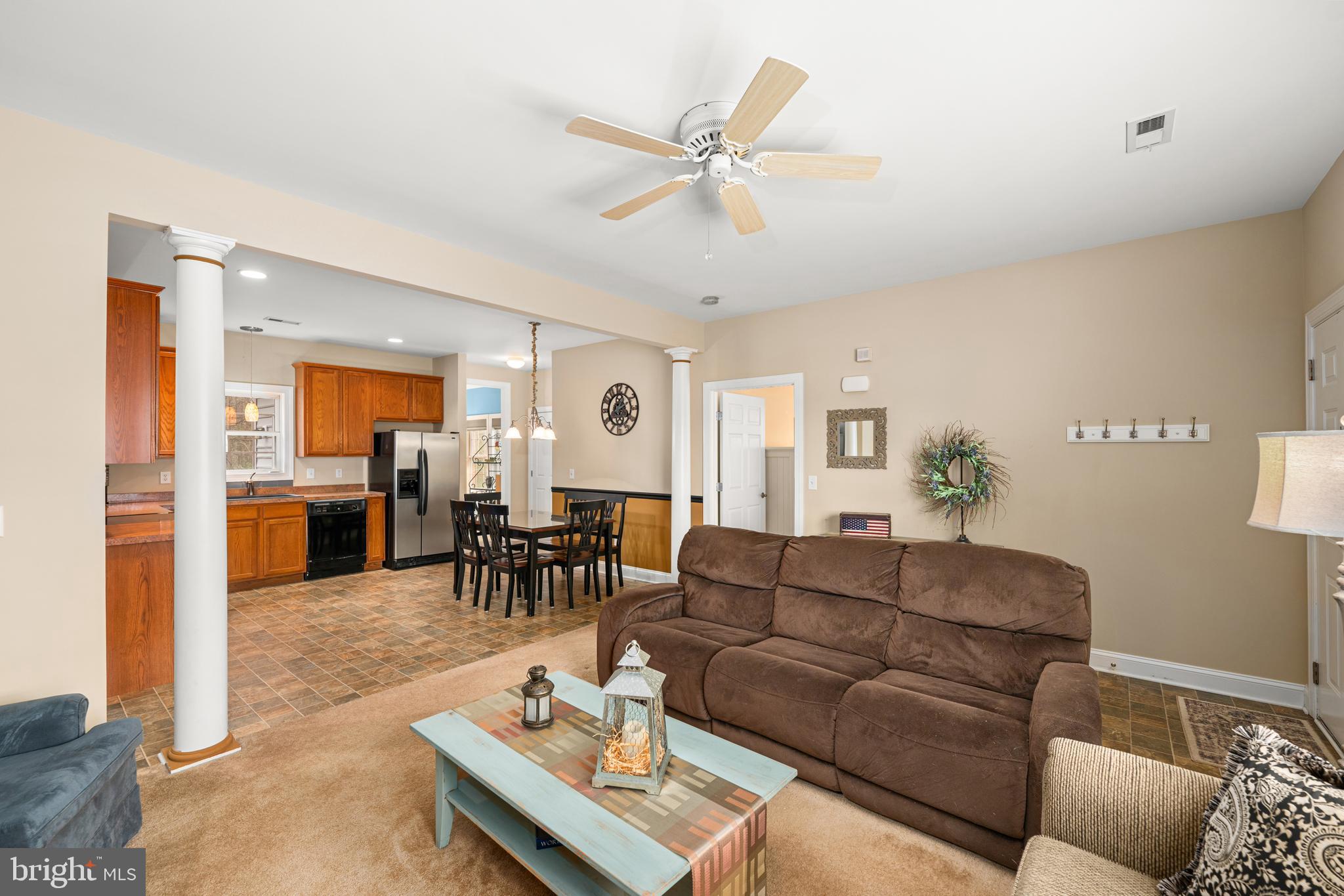 27400 Walking Run Milton, DE 19968 - Photo 5 of 35 a living room with furniture and kitchen view
