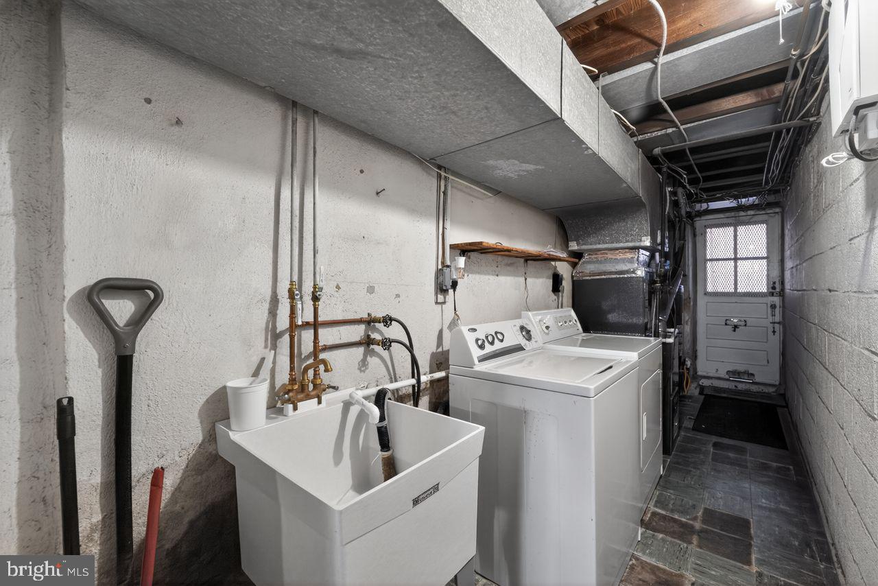 7015 Large Street Philadelphia, PA 19149 - Photo 23 of 26 Functional laundry space with utility access.