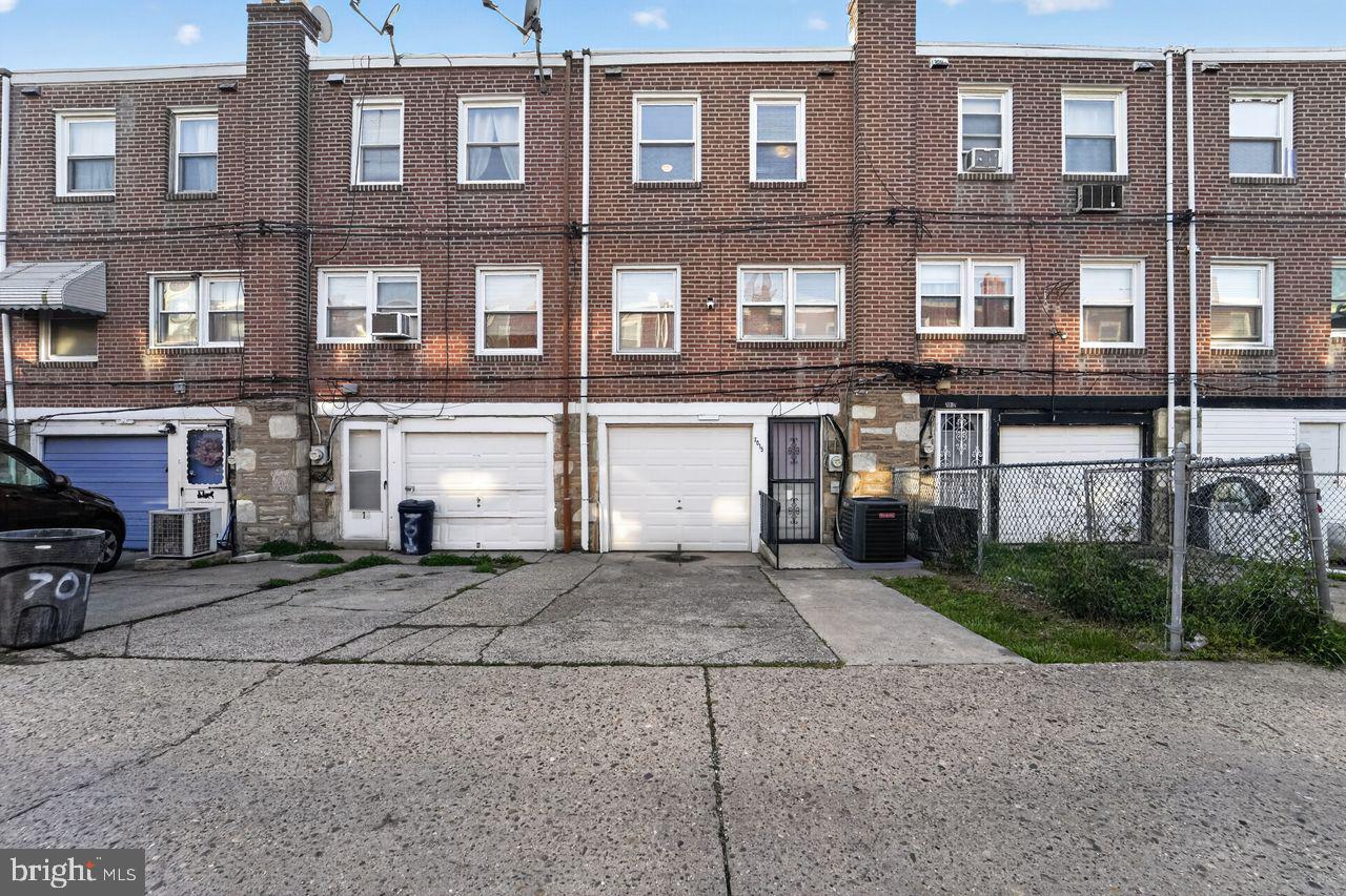 7015 Large Street Philadelphia, PA 19149 - Photo 25 of 26 Charming brick townhomes with garages.