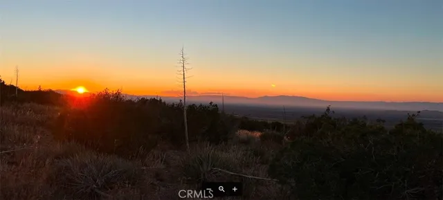 a view of a house with a mountain