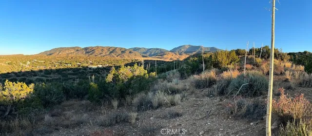 a view of an ocean and a mountain