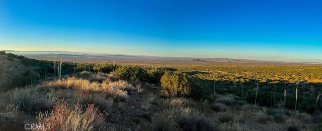 a view of a city with mountains in the background