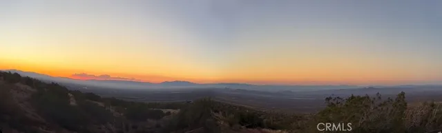 a view of a street with a ocean