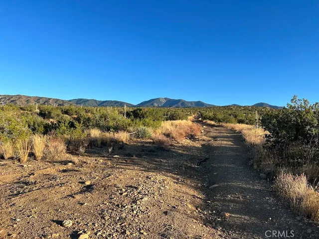 a view of mountain and mountains