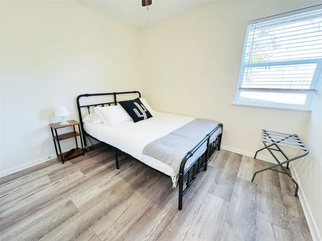 a bedroom with a bed and a table