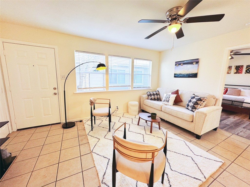 2405 Teri Road Austin, TX 78744 - Photo 5 of 18 a living room with furniture and a rug
