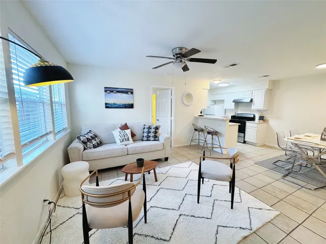 a living room with furniture and a window
