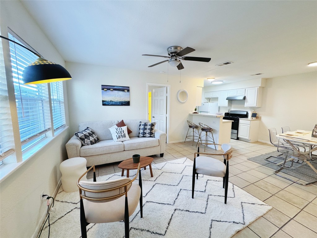 2405 Teri Road Austin, TX 78744 - Photo 6 of 18 a living room with furniture and a window
