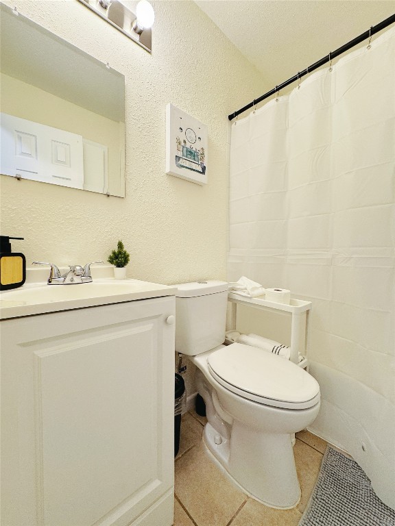 2405 Teri Road Austin, TX 78744 - Photo 10 of 18 a white toilet sitting next to a bathroom sink
