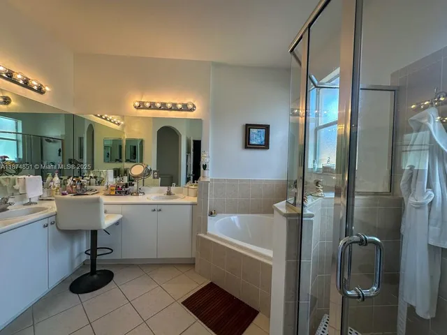 a view of living room kitchen and entryway