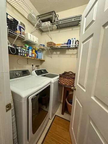 a utility room with dryer and washer