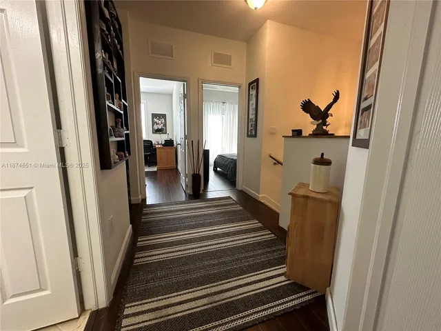 a view of a hallway view with staircase