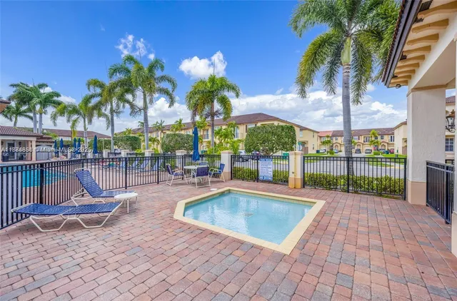 a view of outdoor space with swimming pool and patio