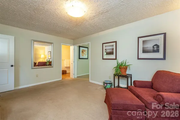 a bedroom with furniture and window