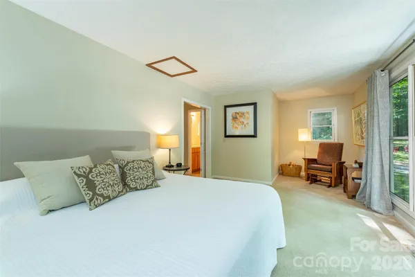 a bedroom with a bed and a couch
