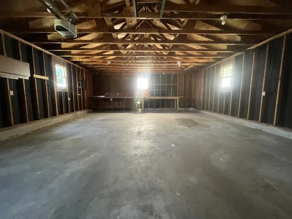 a view of an empty room with wooden walls