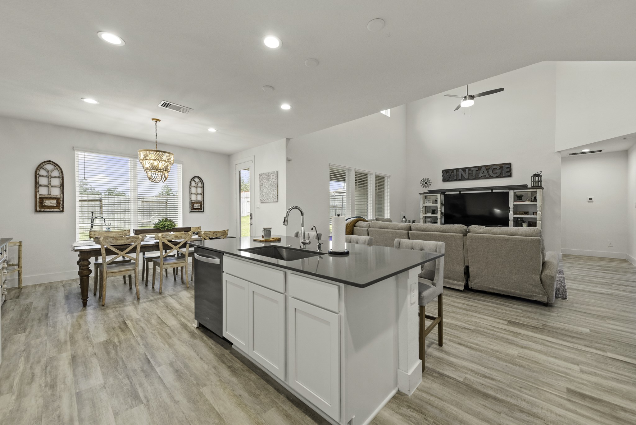 10009 Gray Jay Court Conroe, TX 77384 - Photo 17 of 47 a kitchen with lots of counter space a sink appliances and cabinets