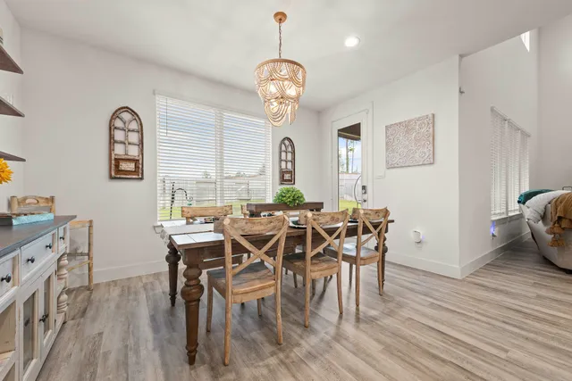 a spacious bathroom with a tub sink and mirror