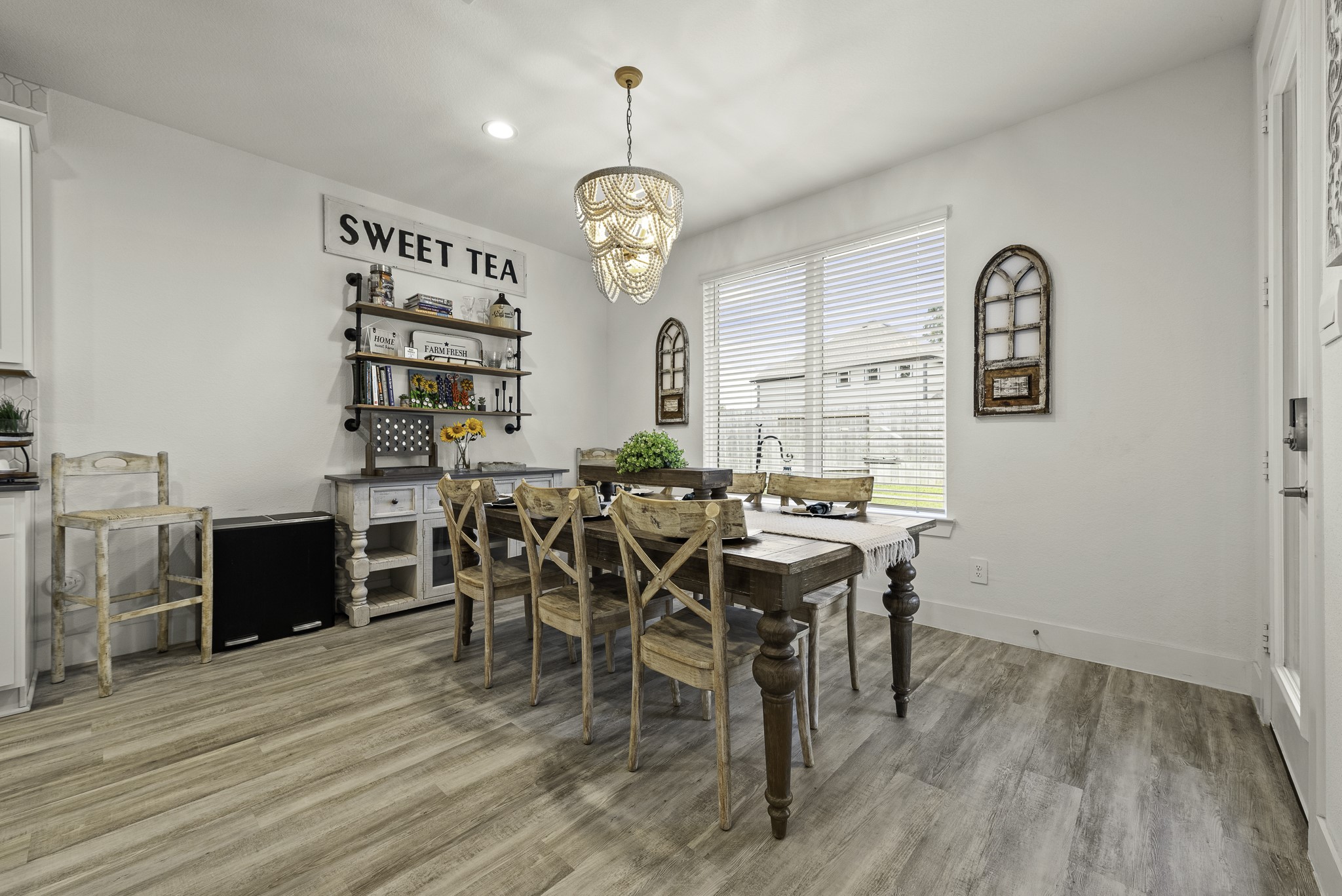 10009 Gray Jay Court Conroe, TX 77384 - Photo 20 of 47 a view of a dining room with furniture window and wooden floor