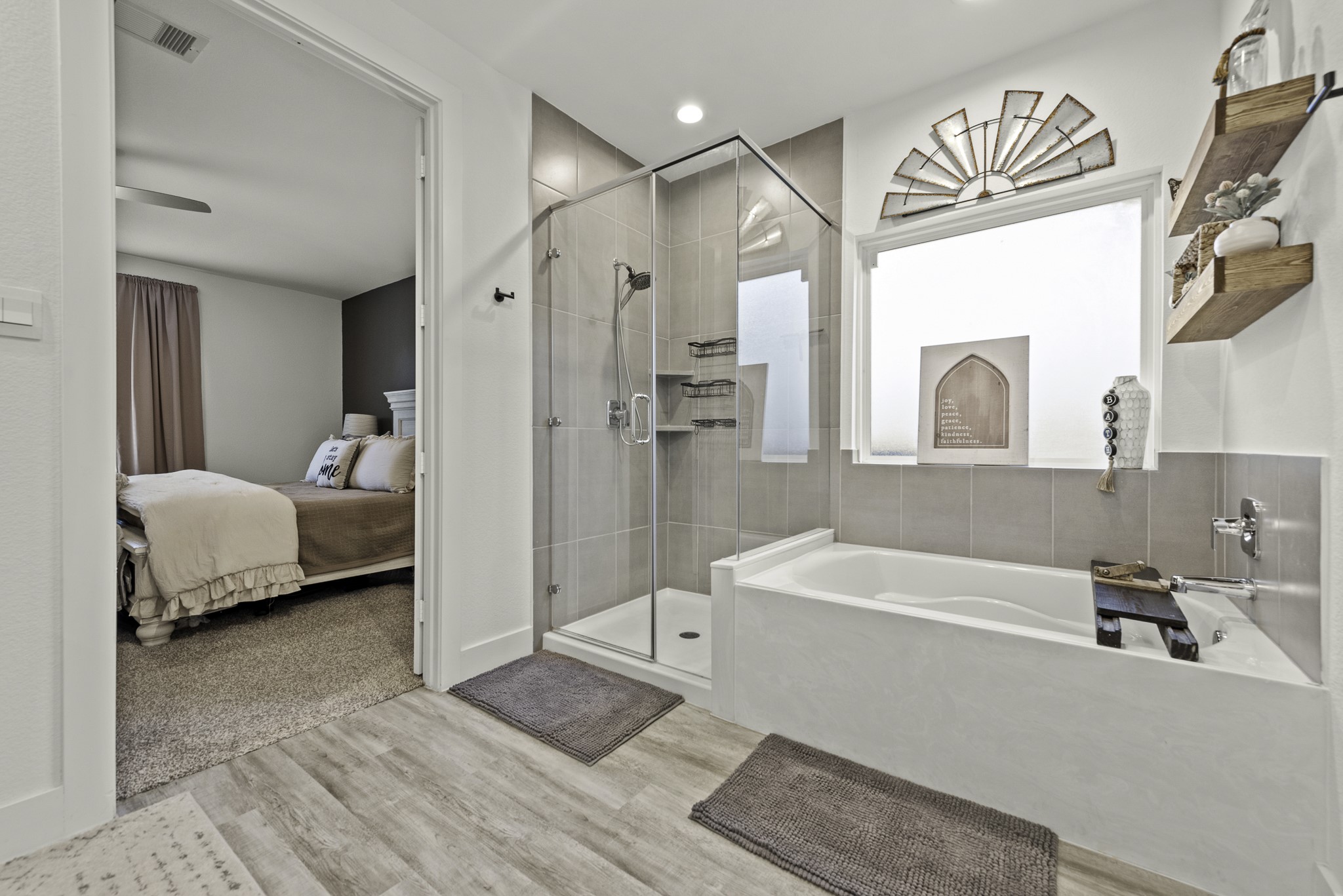 10009 Gray Jay Court Conroe, TX 77384 - Photo 23 of 47 a en suite spacious bathroom with a tub double vanity and glass door