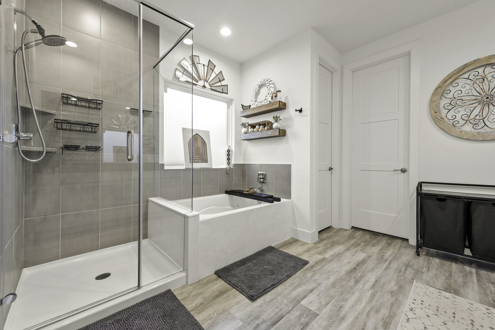 10009 Gray Jay Court Conroe, TX 77384 - Photo 24 of 47 a bathroom with a sink a mirror and a shower