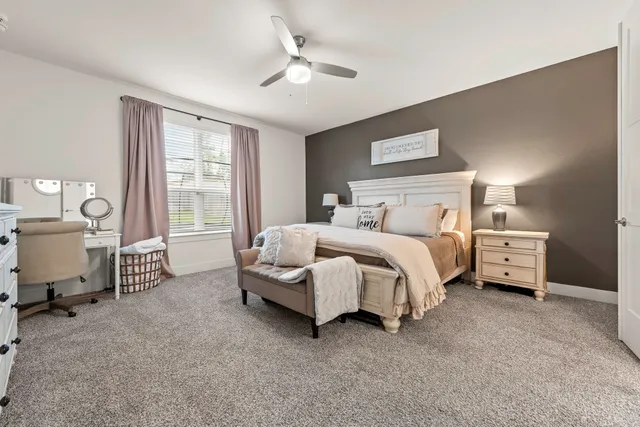 a bedroom with furniture and a window